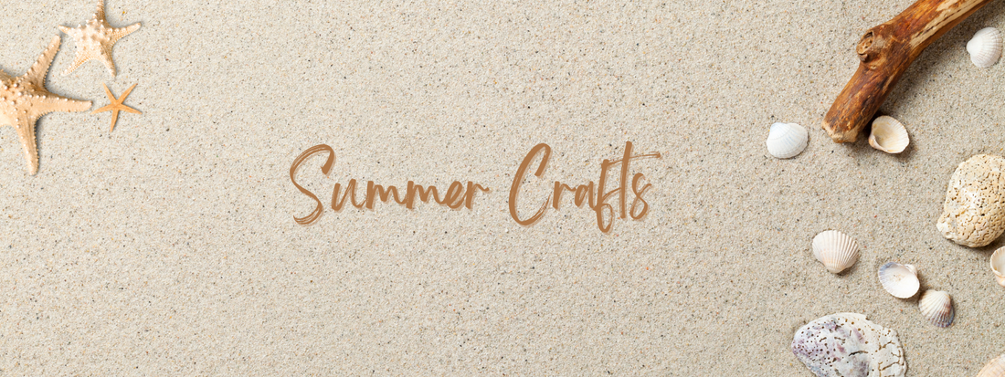 Sand background with Summer Crafts written in the sand
