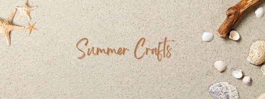 Sand background with Summer Crafts written in the sand