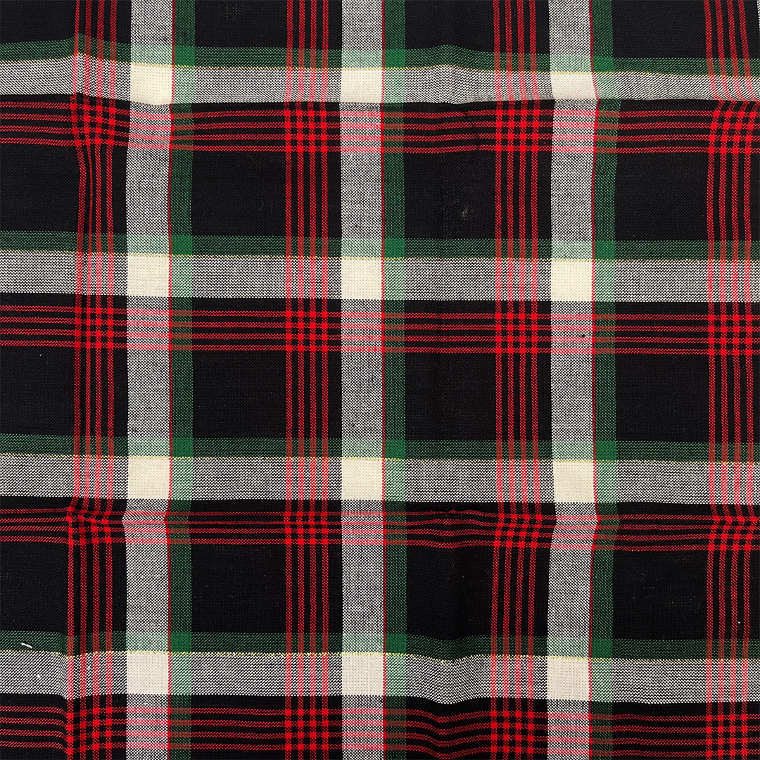 Plaid fabric with black, red, green, and white pattern