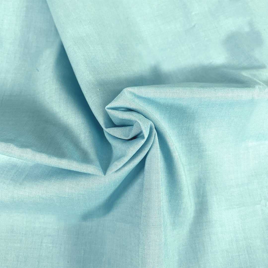 Close-up of light blue fabric with folds