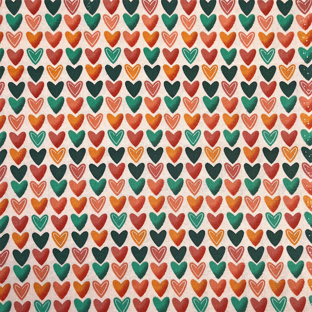 Pattern of colorful hearts on a beige background