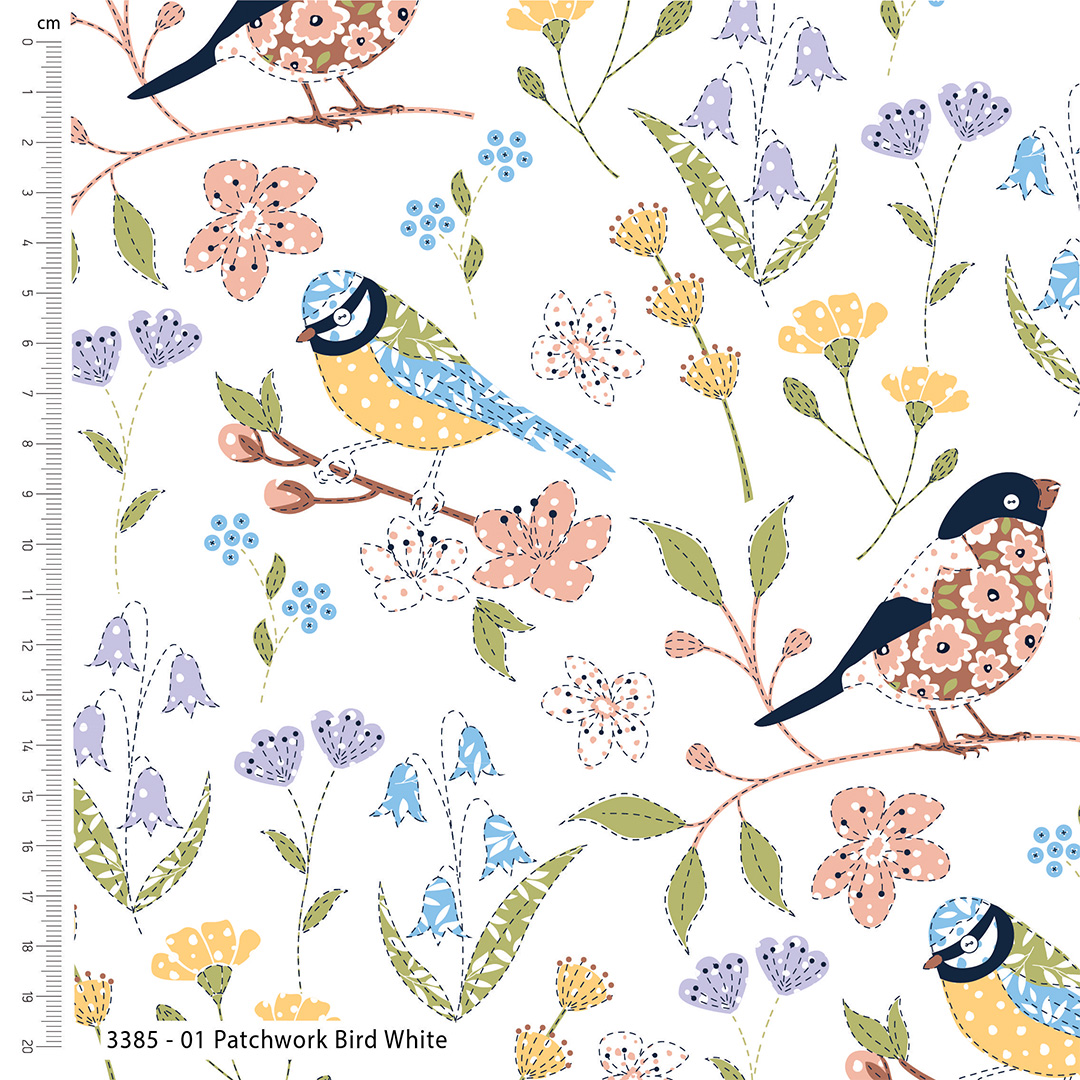 Patterned fabric with birds and flowers on a white background, featuring a ruler for scale.