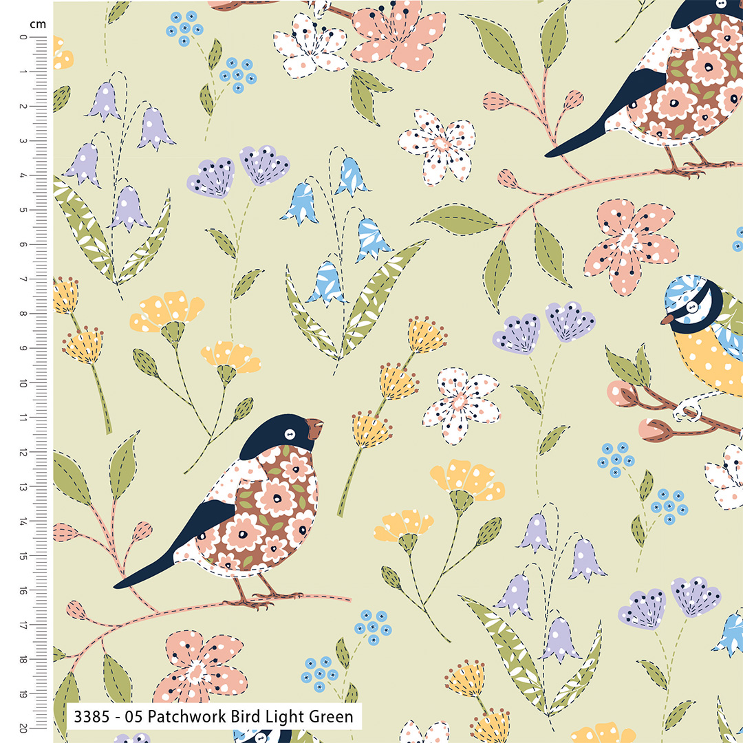 Fabric with birds and flowers pattern on a light green background, featuring a ruler on the left side.