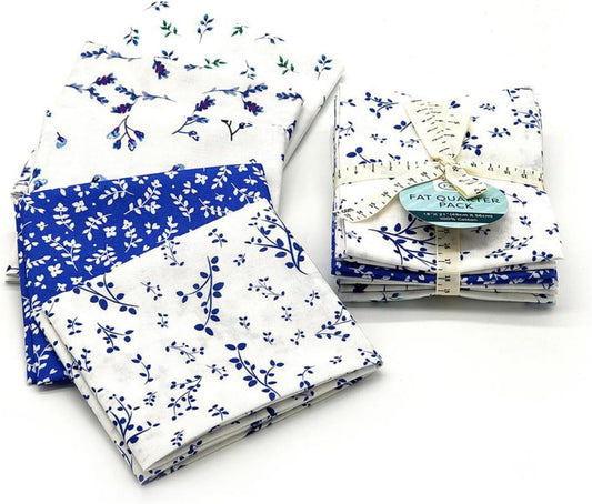 Collection of blue and white floral fabric packs on a white background