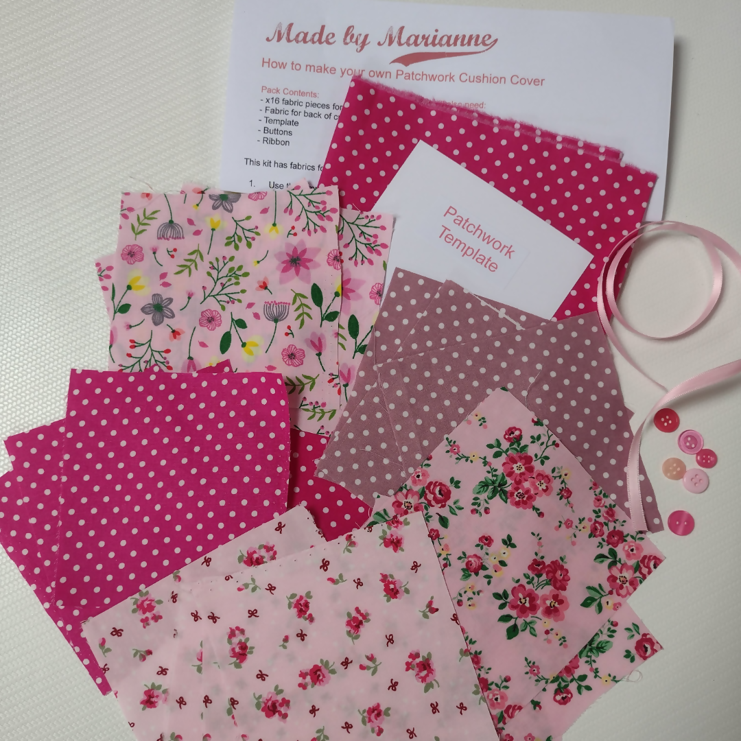 Pink floral and polka dot fabric samples with a sewing guide and scissors on a white background