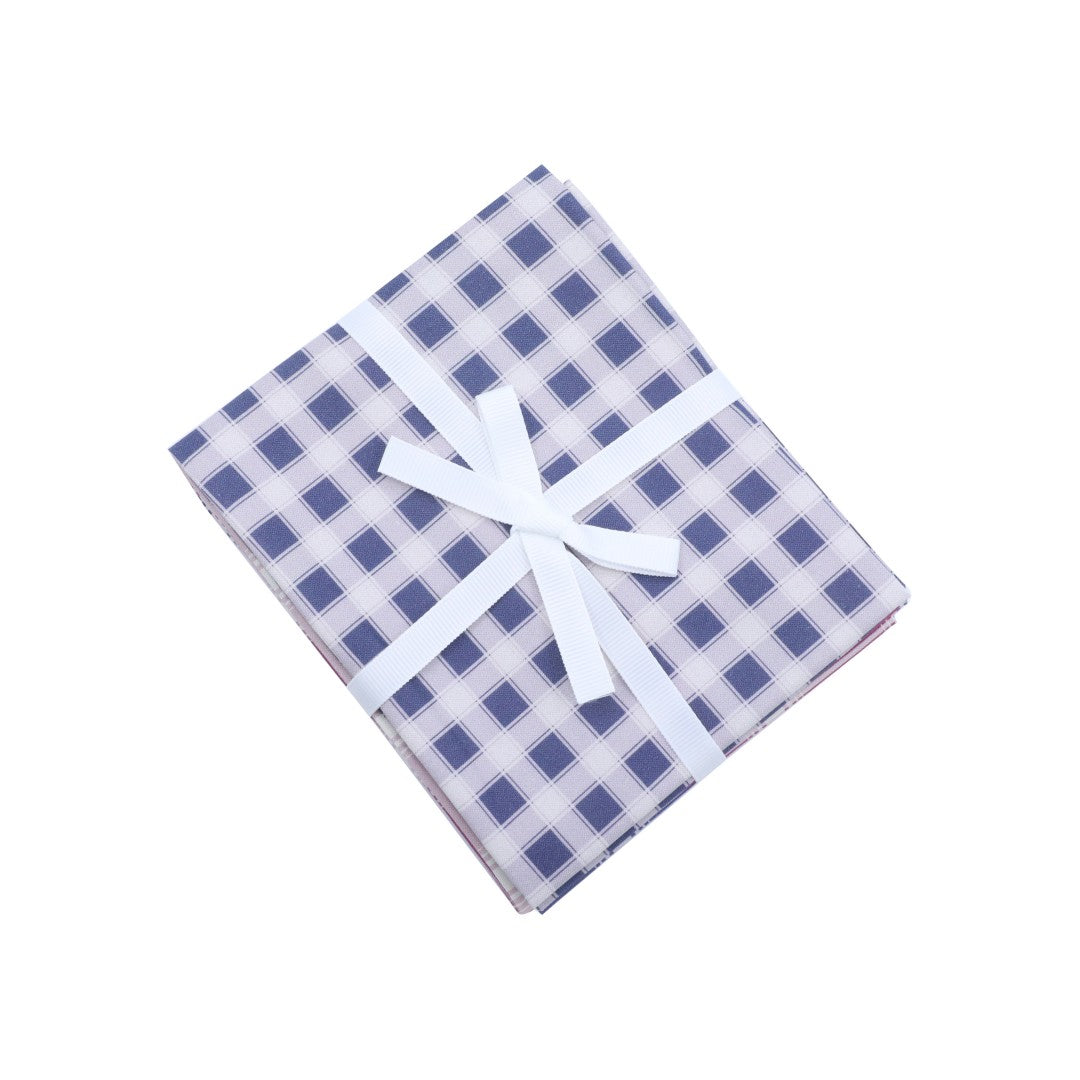 Blue and white checkered fabric with a white ribbon on a white background