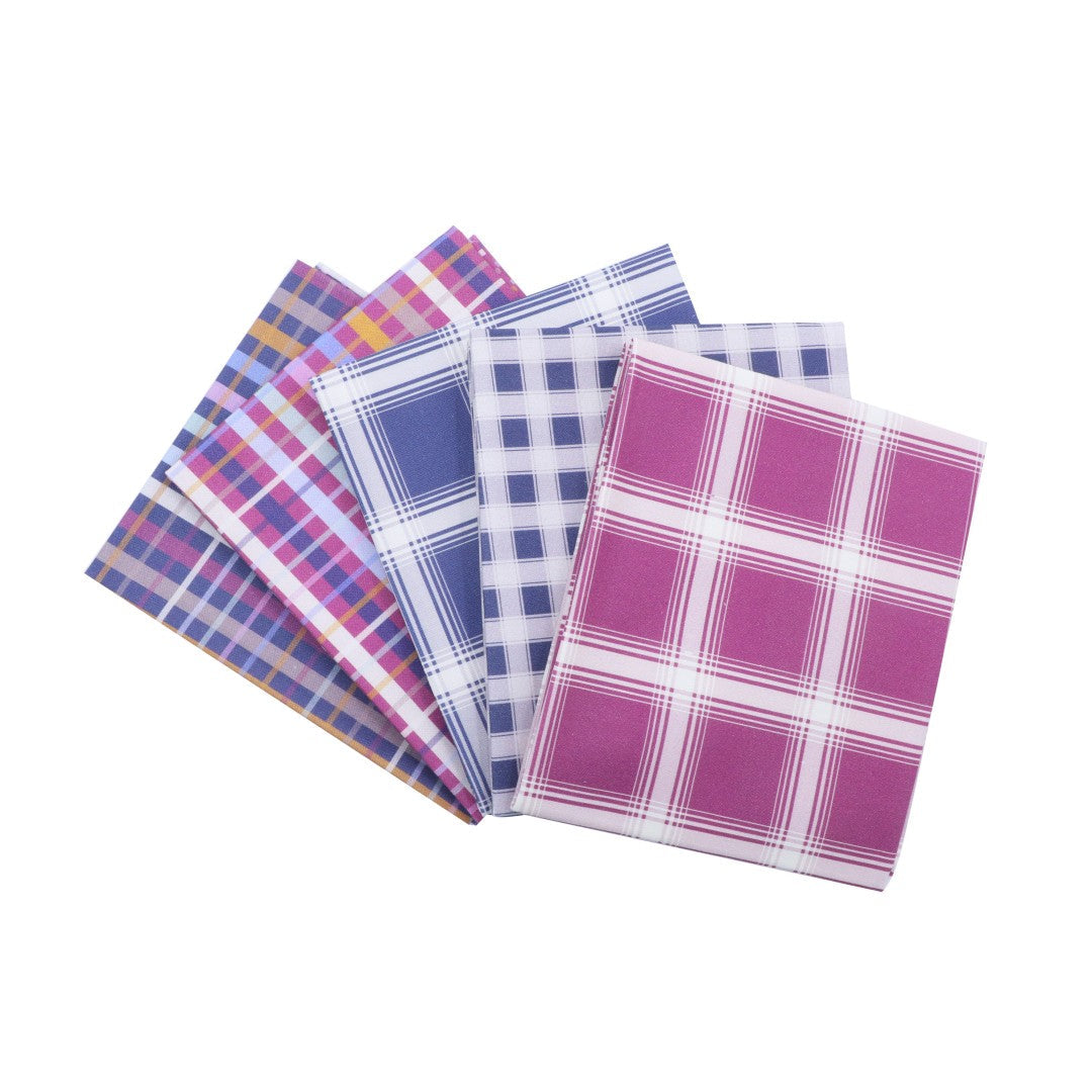 Set of plaid patterned towels on a white background