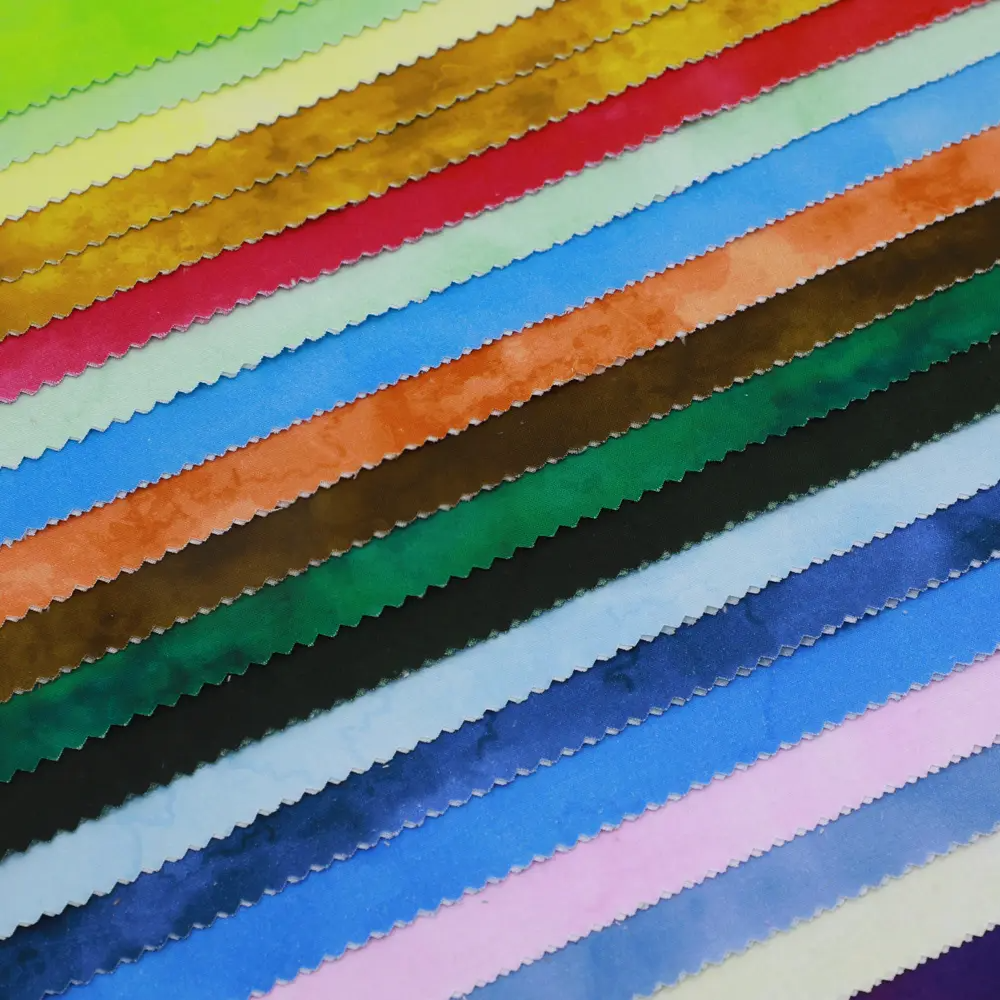 Stack of colorful fabric swatches arranged in a grid.