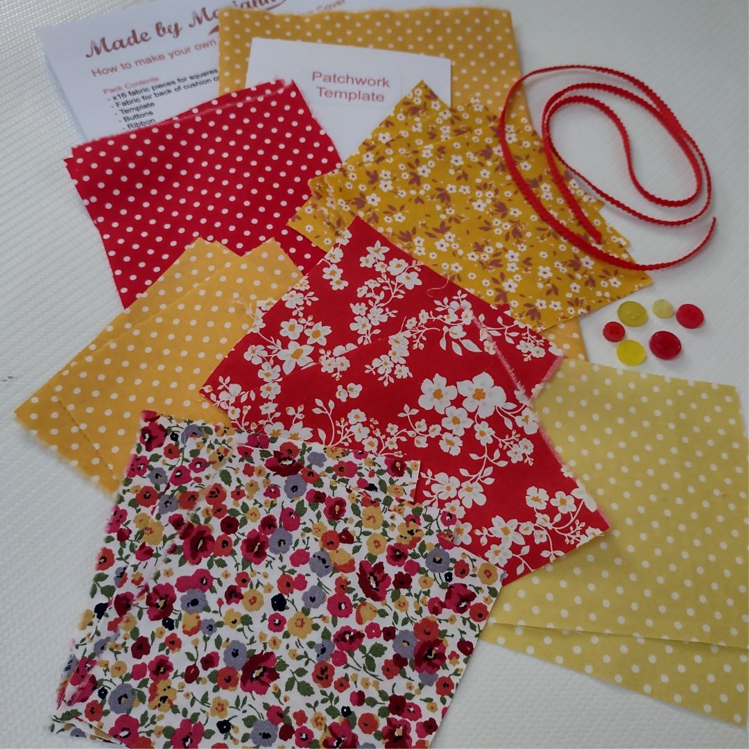 Collection of colorful fabric samples with a red ribbon on a white background