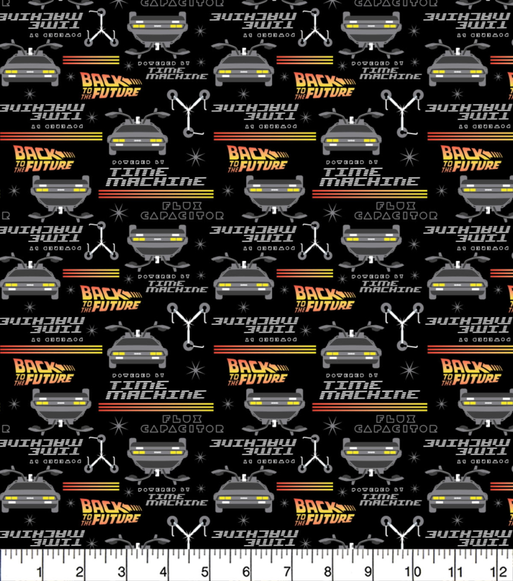 Patterned fabric with 'Back to the Future' theme featuring DeLorean time machine and text on a black background.