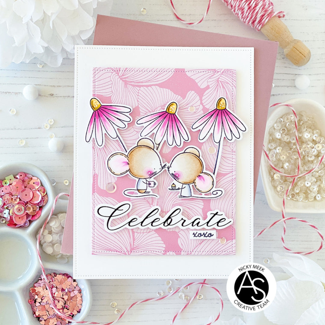 Card with cartoon characters and flowers on a pink background, surrounded by decorative items.