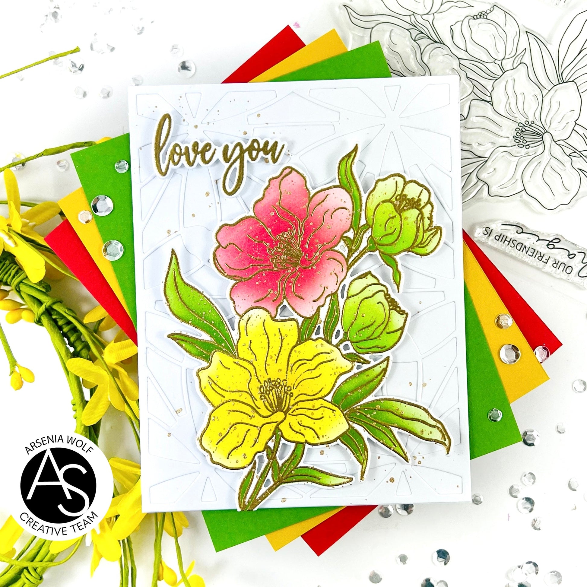 Card with floral design and 'love you' text, surrounded by colorful flags and flowers.