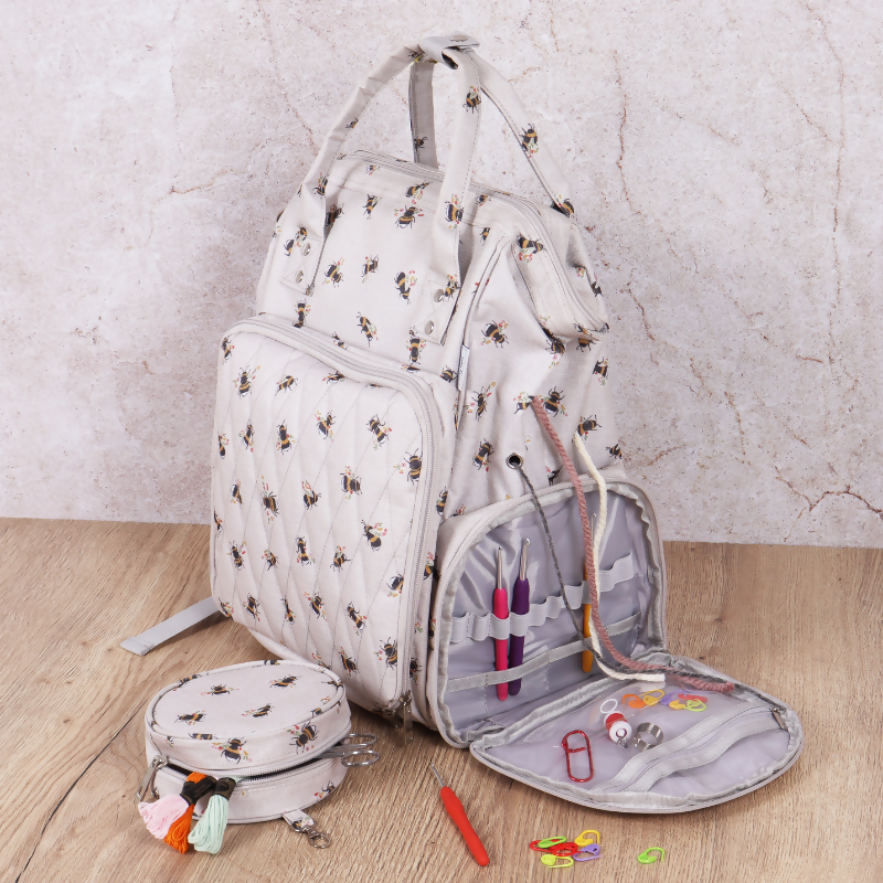 Bee Craft Backpack, open, revealing four internal compartments and organiser panel