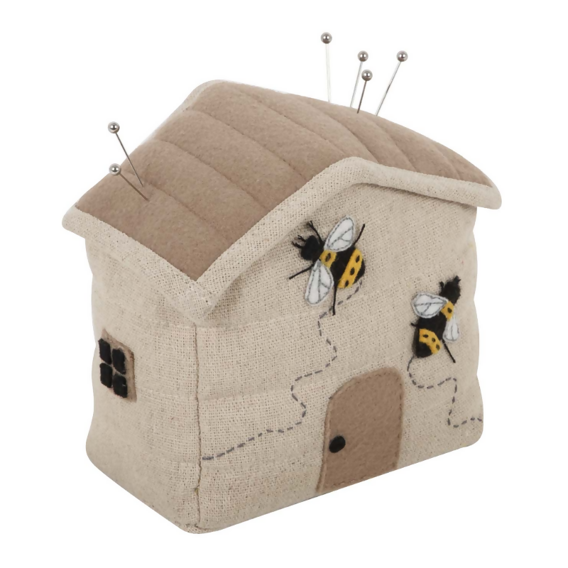 Bee House Pincushion, showing beehive shape and embroidered bee house design