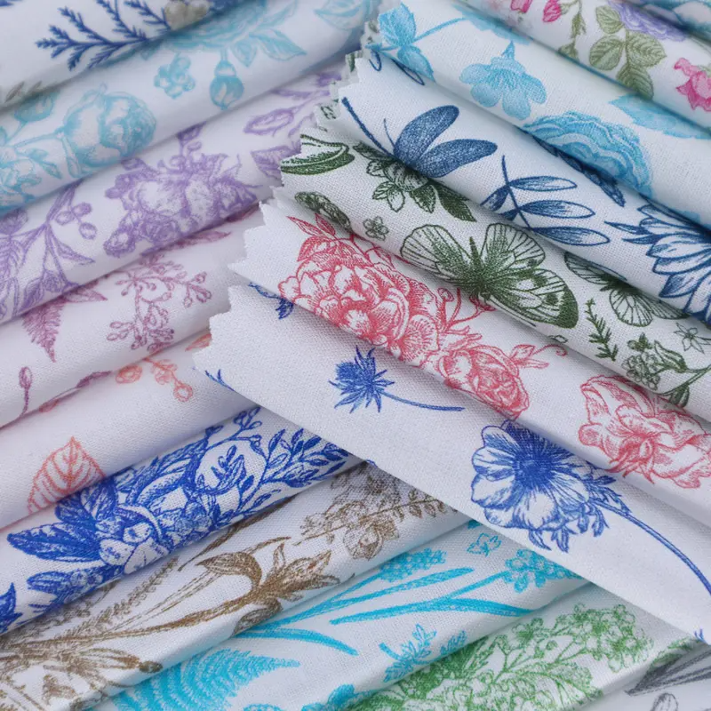 Stack of floral-patterned fabric swatches in various colors.