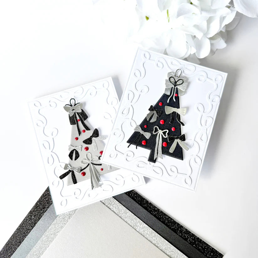 Two decorative cards with black Christmas trees on a white background