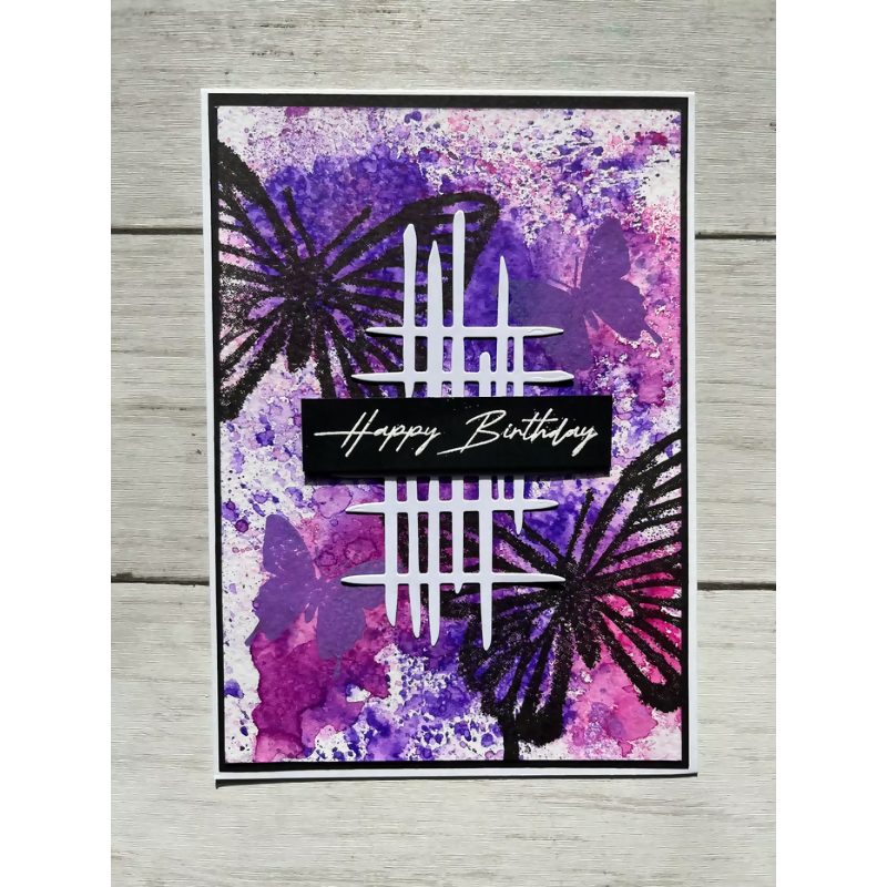 Greeting card with butterflies and 'Happy Birthday' text on a purple and pink watercolor background.