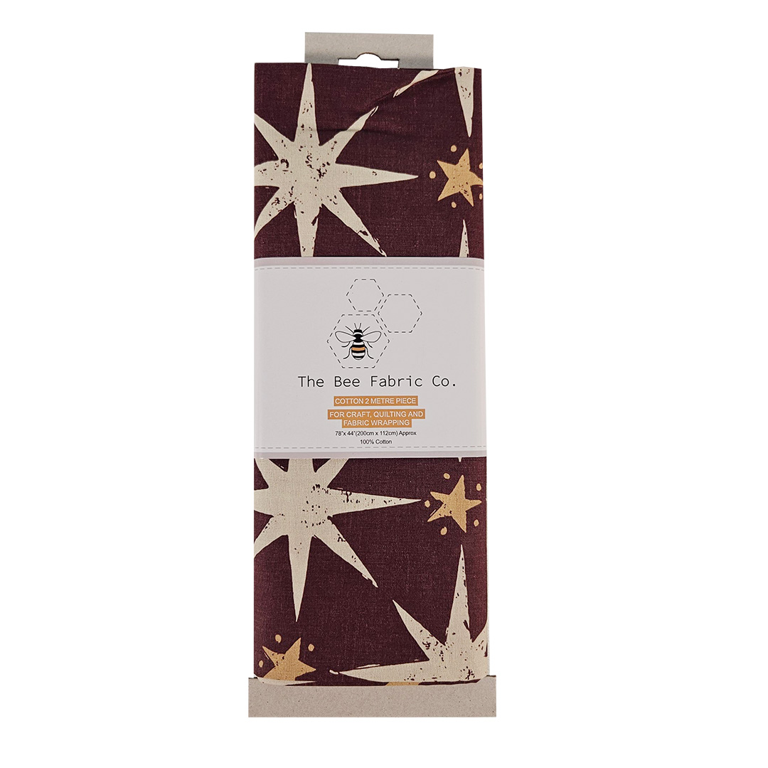 Fabric package with star pattern and 'The Bee Fabric Co.' branding on a white background