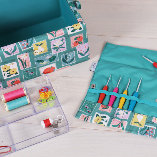 Embroidered Stamps Crochet Wrap Case, open showing 10 empty elastic slots for hooks