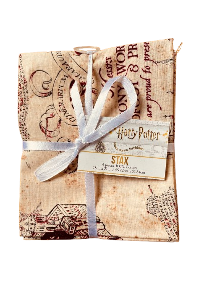 Packaged product with a white ribbon and 'Harry Potter' branding on a white background