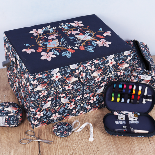 Large Embroidered Blossom Birds Sewing Box, open, revealing twin lids, internal plastic tray, pincushion, and pocket