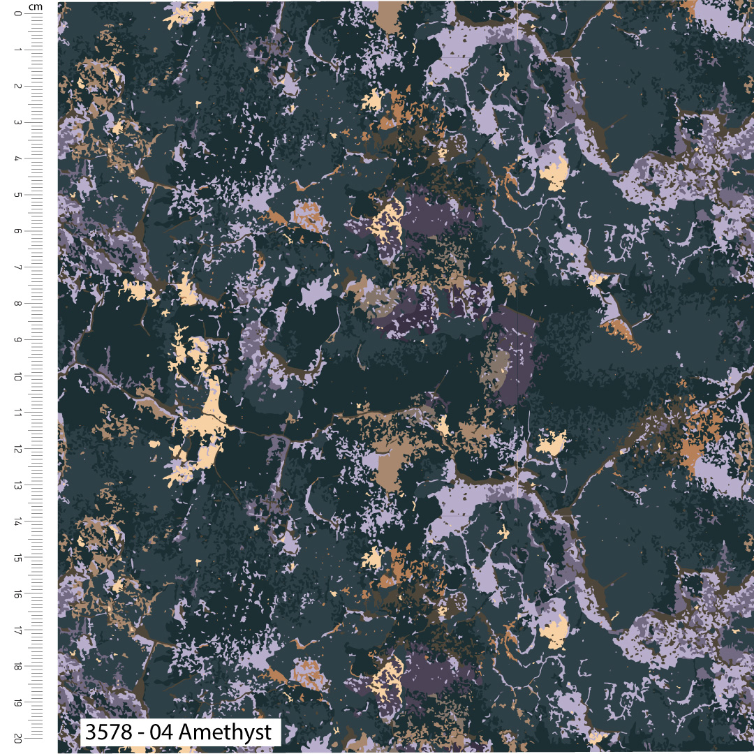 Textured fabric with gold and purple speckles on a dark background, with a ruler for scale.