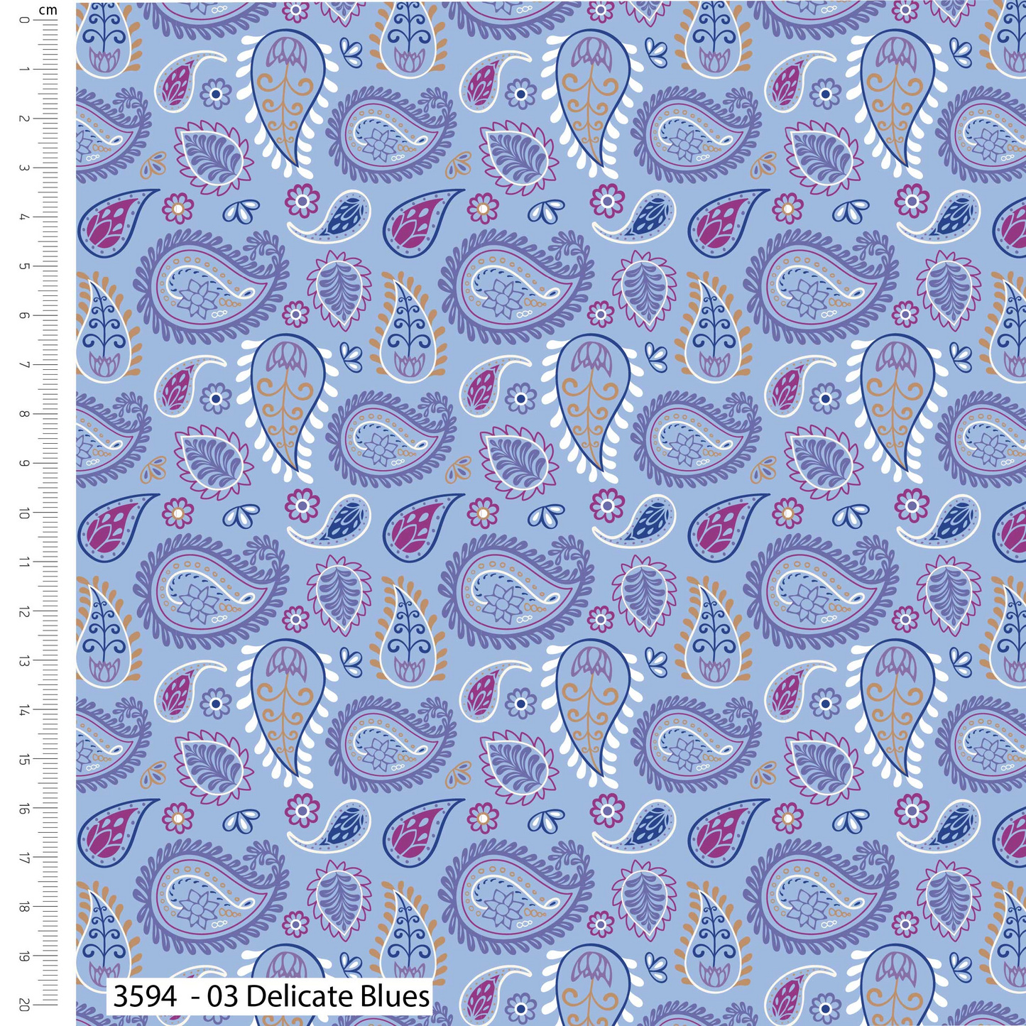 Patterned fabric with paisley design in purple, blue, and pink on a light blue background, with a ruler for scale.
