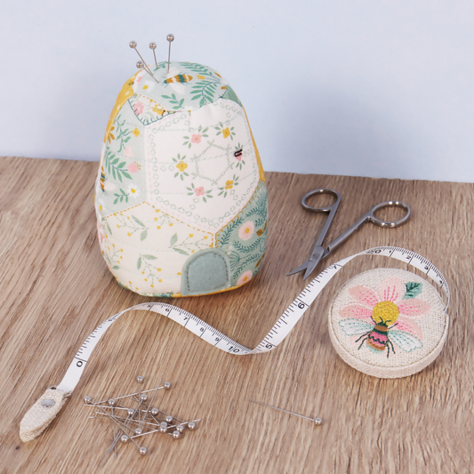 Patchwork Bee Beehive Pincushion with sewing pins inserted