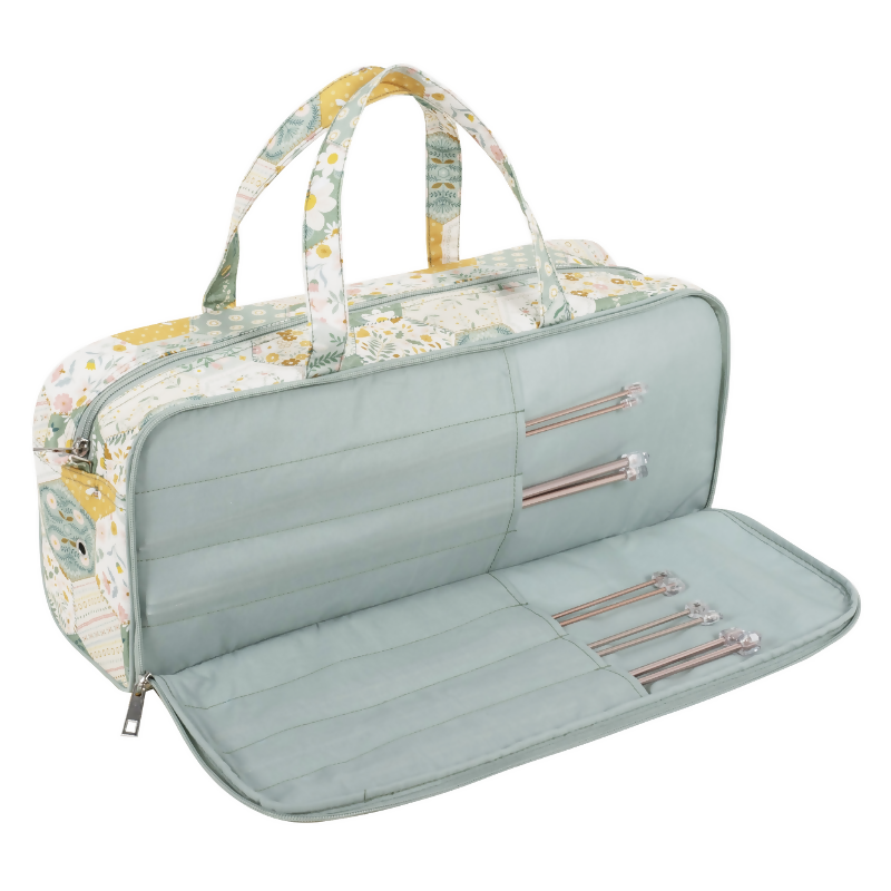 Patchwork Bee Knitting Bag, open, revealing spacious interior, internal sleeve for pins, and elastic loops