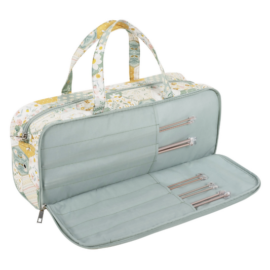 Patchwork Bee Knitting Bag, open, revealing spacious interior, internal sleeve for pins, and elastic loops