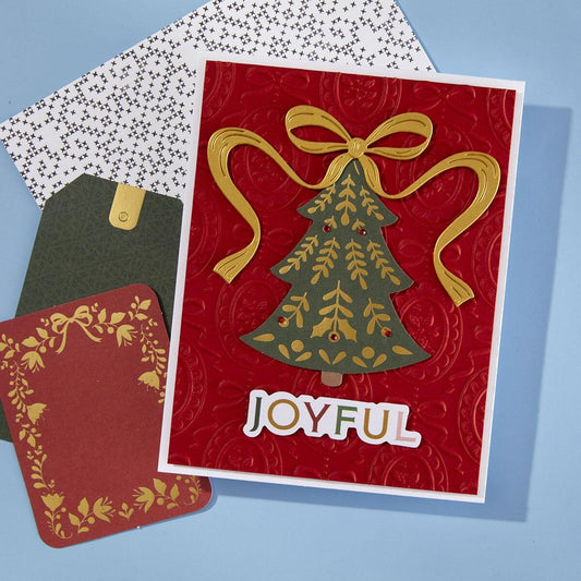 A greeting card with a 3D embossed Christmas cameo design created with the embossing folder.