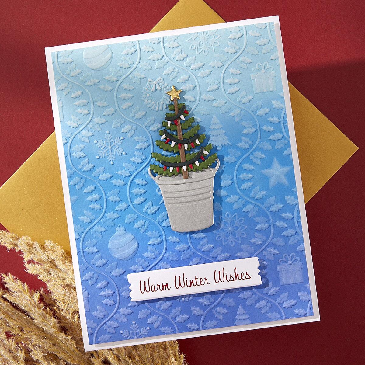 A greeting card with a 3D embossed rustic Christmas design created with the embossing folder.