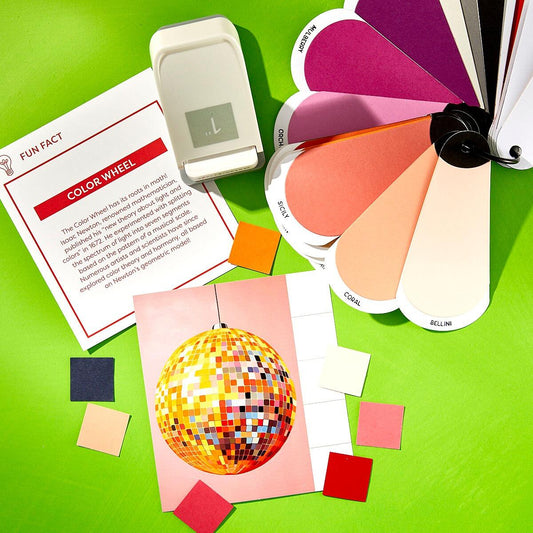 Spellbinders Color swatches, color wheel, and disco ball on a green background