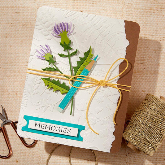 A greeting card with a 3D embossed floral design created with the embossing folder.