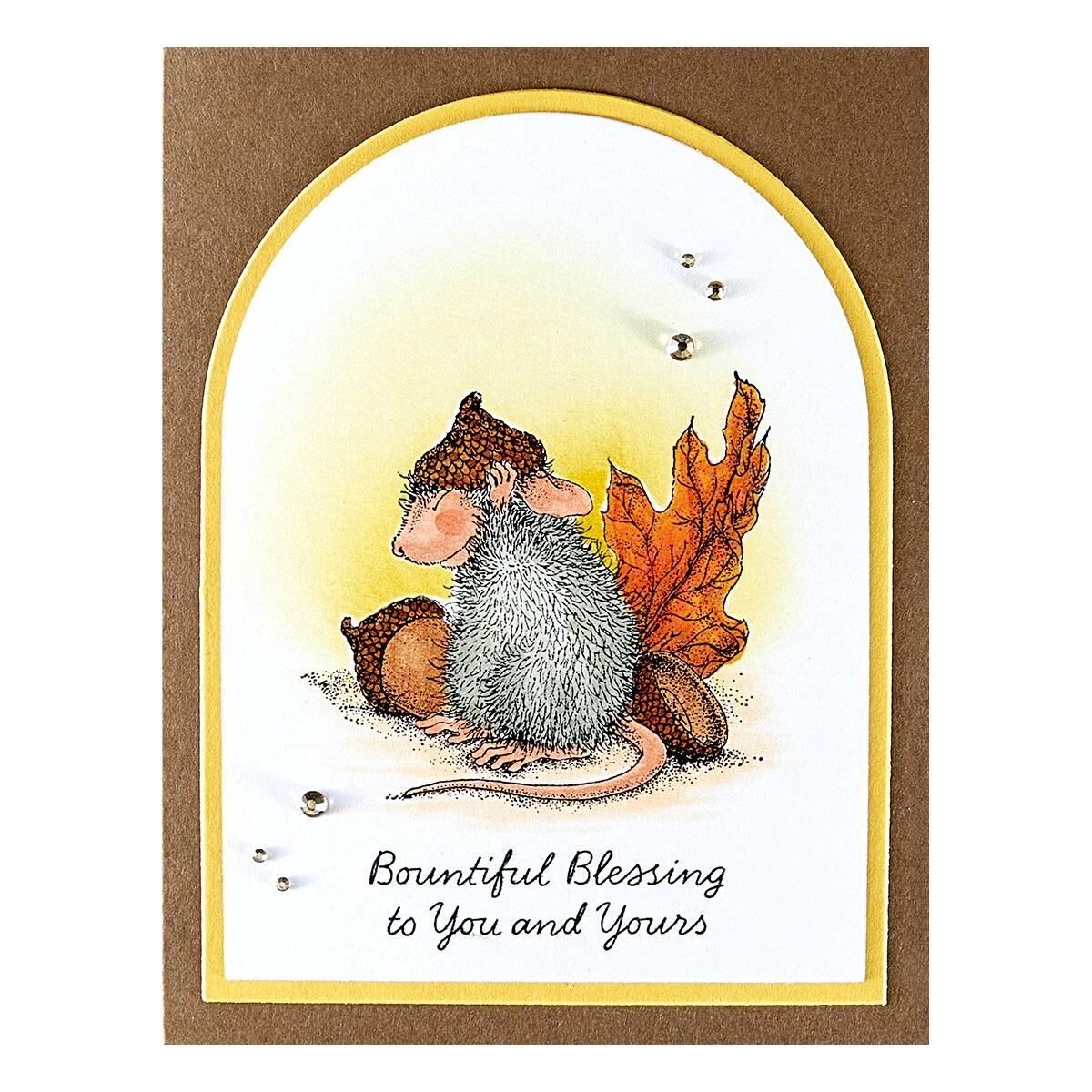 A finished Christmas card featuring a stamped design from the Spellbinders Hats Off to You stamp set.