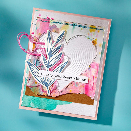 Finished card showcasing a textured circles design created with the Spellbinders Lined Circles Embossing Folder by Dina Wakley.