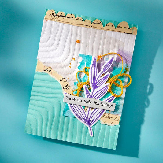 Finished card showcasing the textured design created with the Spellbinders Lined Corners 3D Embossing Folder by Dina Wakley.