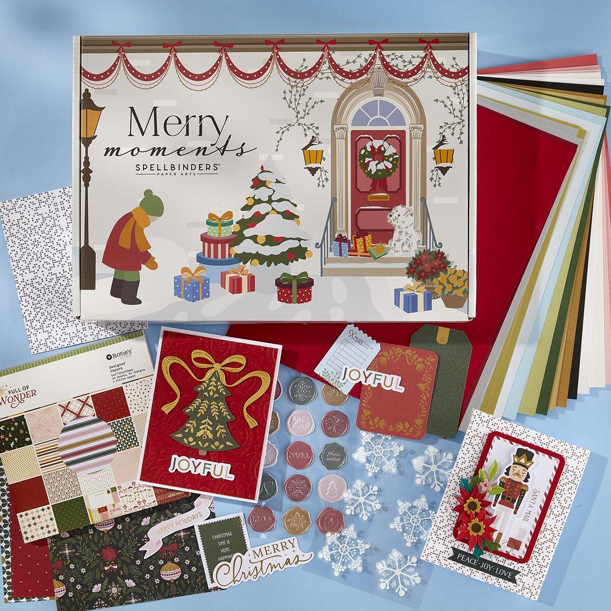 Collection of Christmas-themed cards and stationery items with 'Merry moments' Spellbinders box.