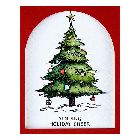 Spellbinders Christmas card with a decorated tree and 'Sending Holiday Cheer' text on a red border.