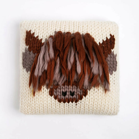 Knitted pouch with brown and beige pattern on a white background