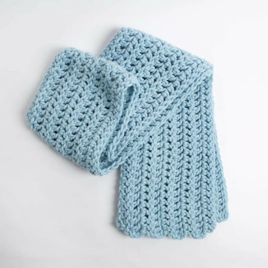 Light blue knitted scarf on a white background