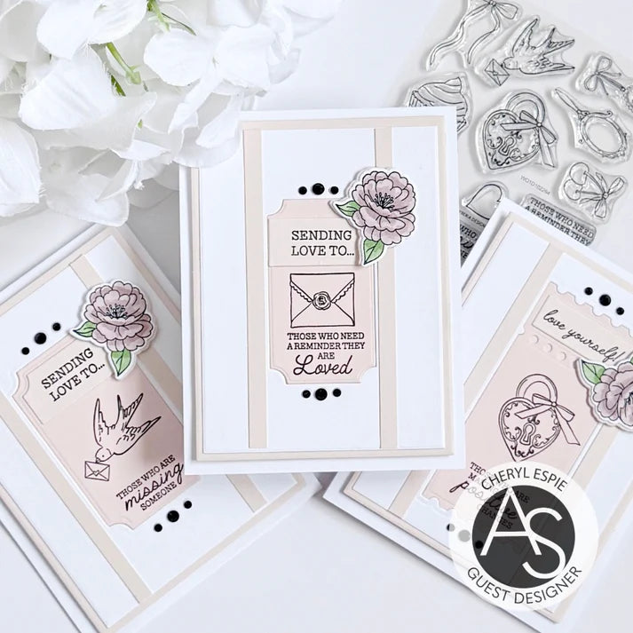 Card with floral design and text, surrounded by clear stamps on a light background