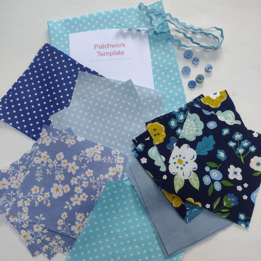 Collection of blue and floral patterned fabrics with a patchwork template on a white background