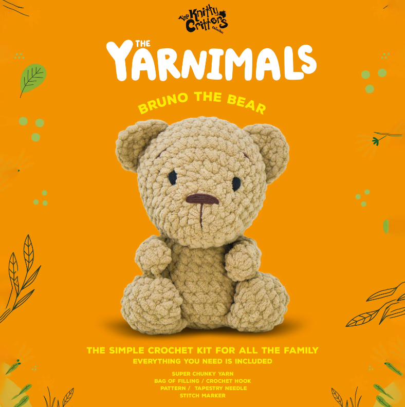 Crocheted bear toy on an orange background with 'The Yarnimals' branding.