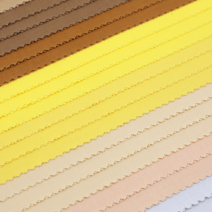 Color swatches of fabric in brown, yellow, beige, and pink.
