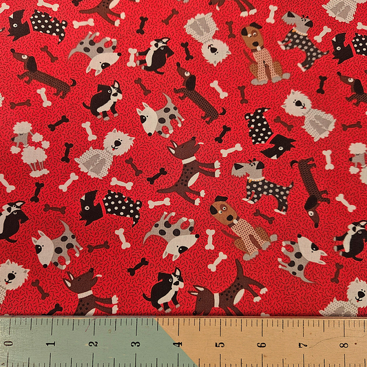 Pattern of cartoon dogs and bones on a red background with rulers at the bottom.