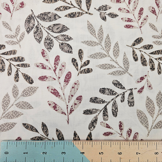 Floral patterned fabric with a ruler at the bottom for scale.