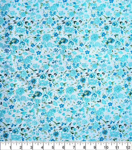 Blue floral pattern fabric with a ruler for scale