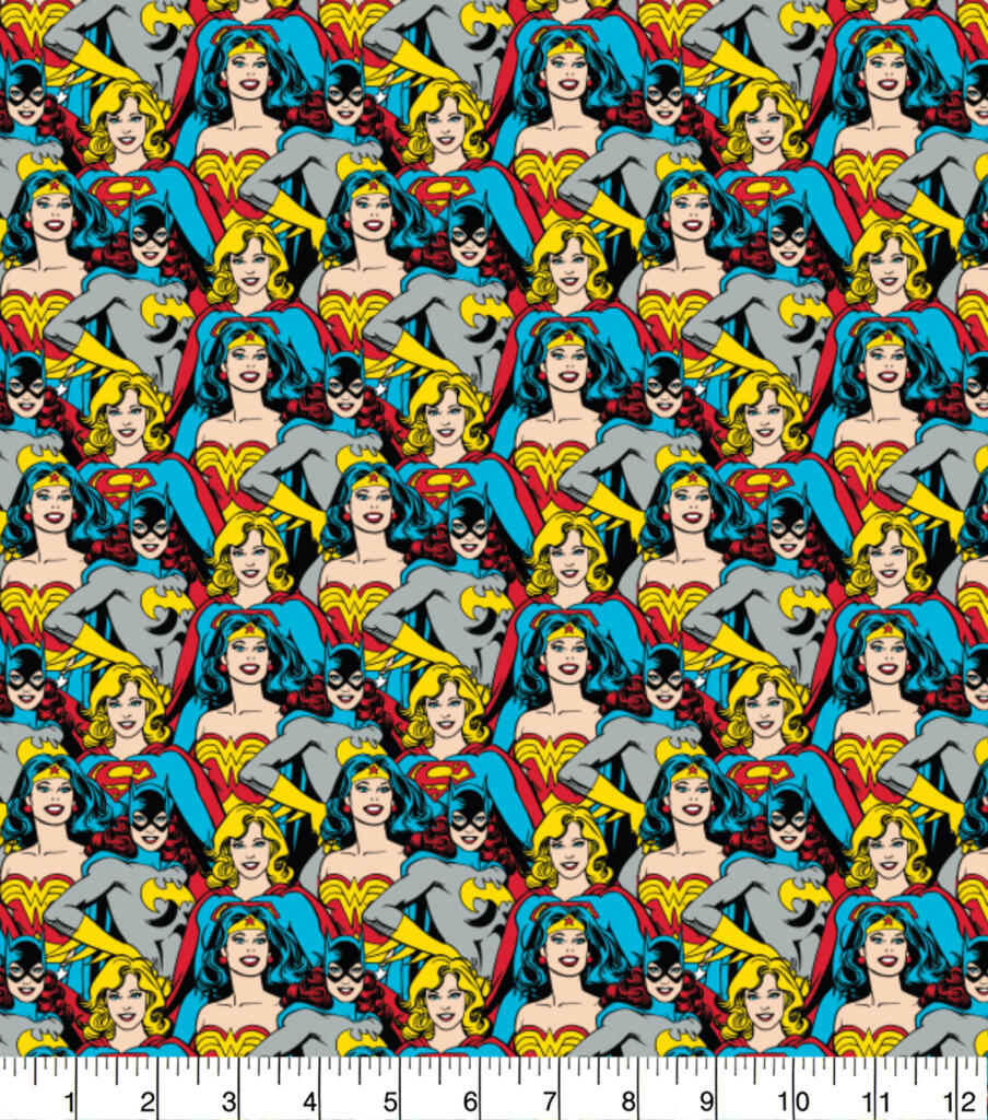 Pattern of superheroine characters on a fabric background with a ruler at the bottom.