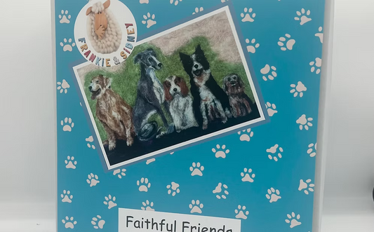 Card with embroidered picture of dogs on a blue background with paw prints